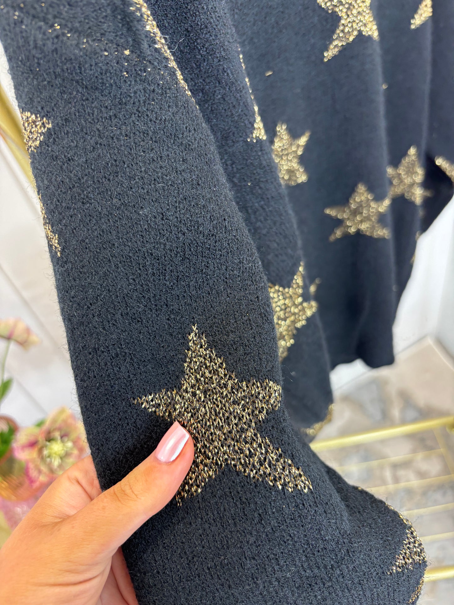 Black star knitted jumper